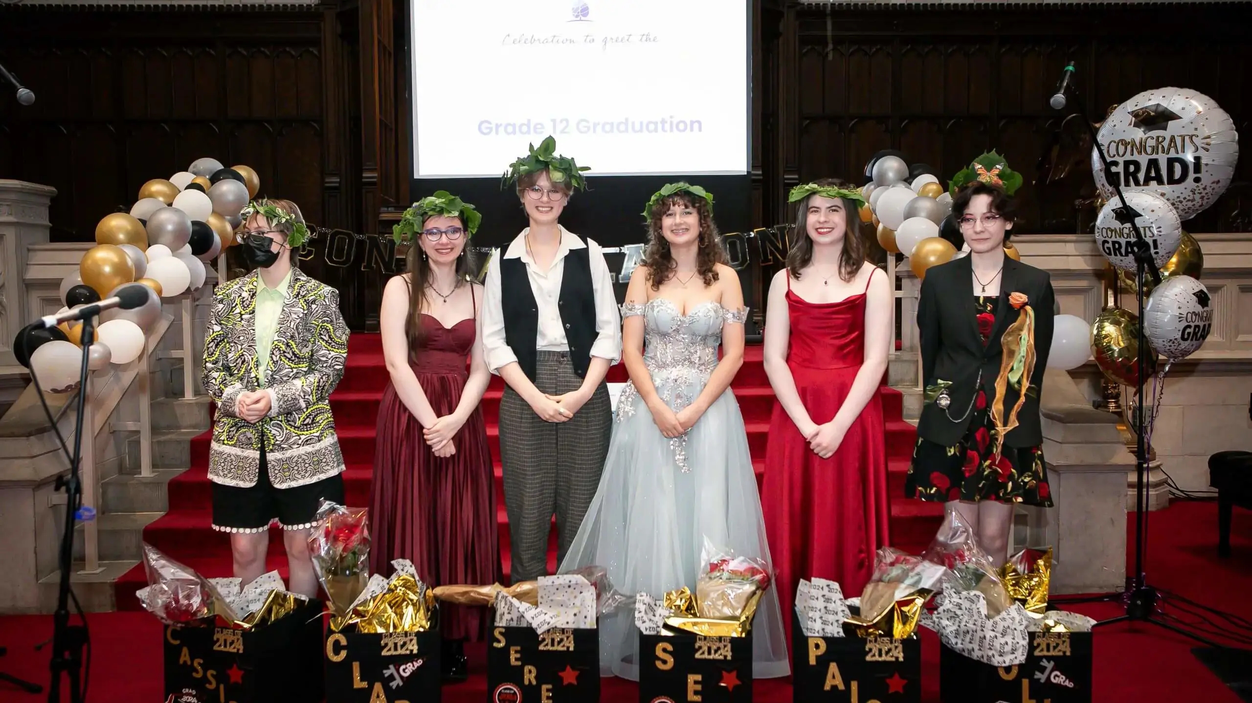 Linden School students wearing wreaths at their Graduation.