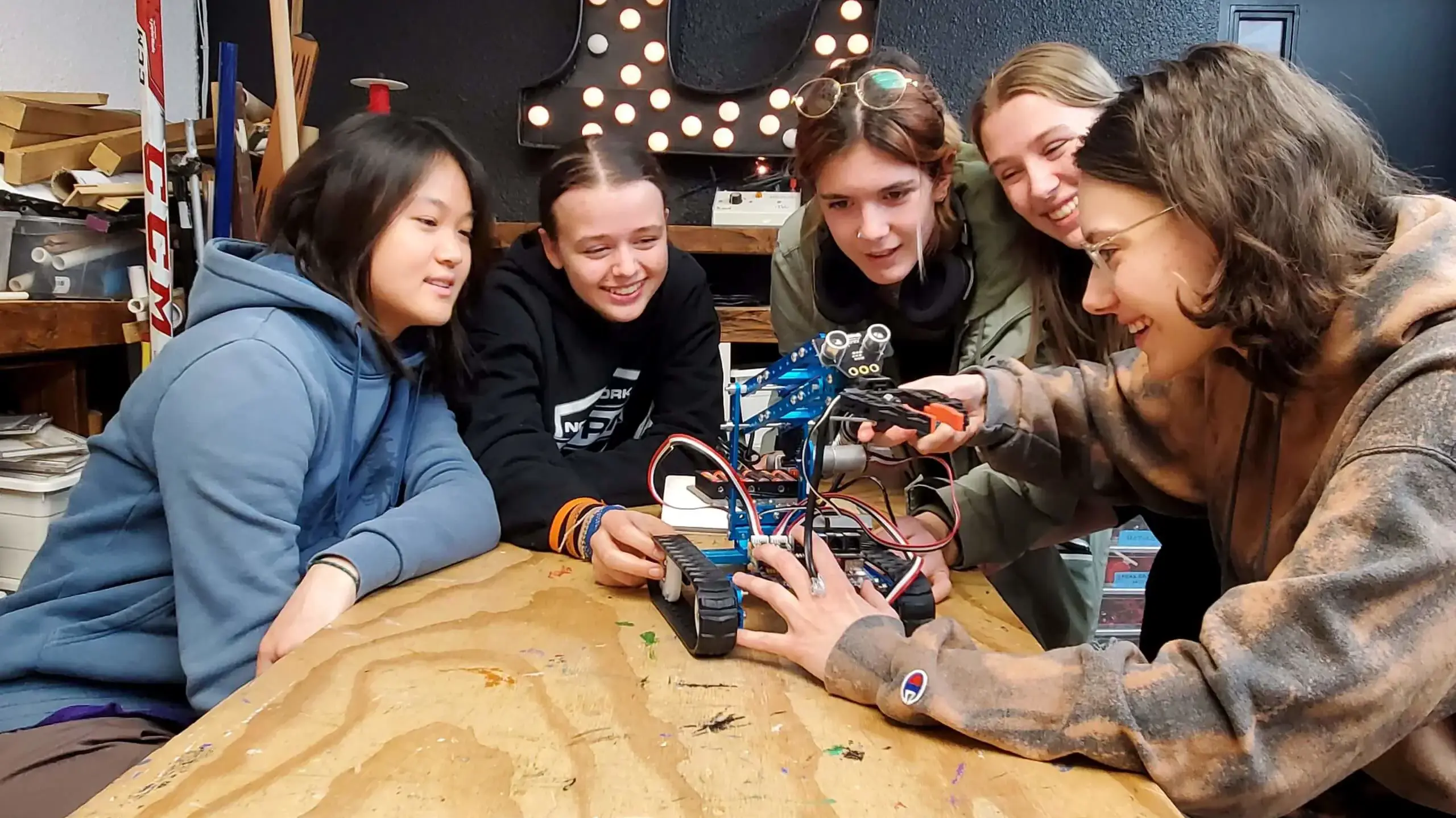 Students working on a robotics project together.