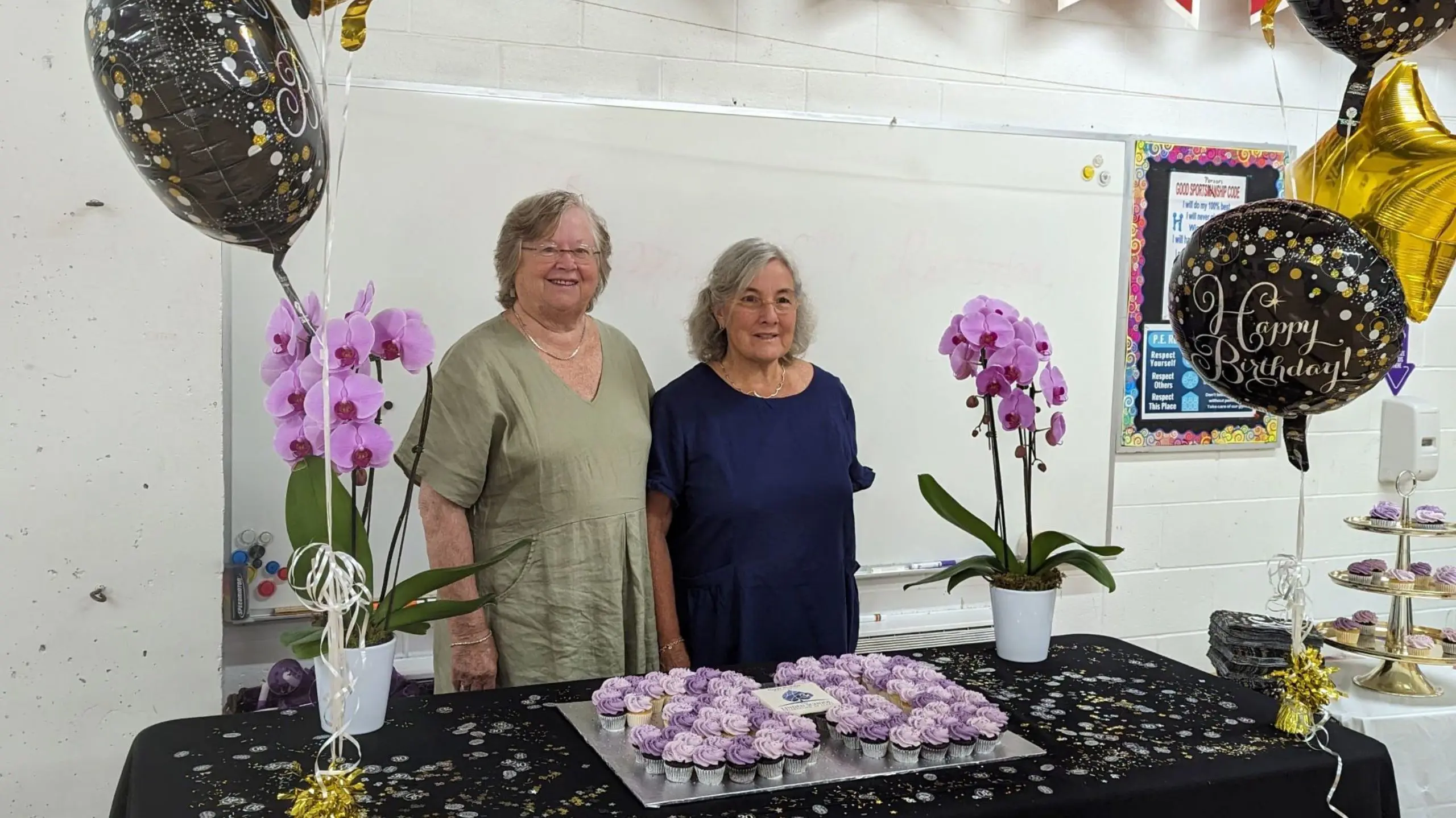 The Linden School founders photographed with balloons and cupcakes at the school's Birthday celebrations.