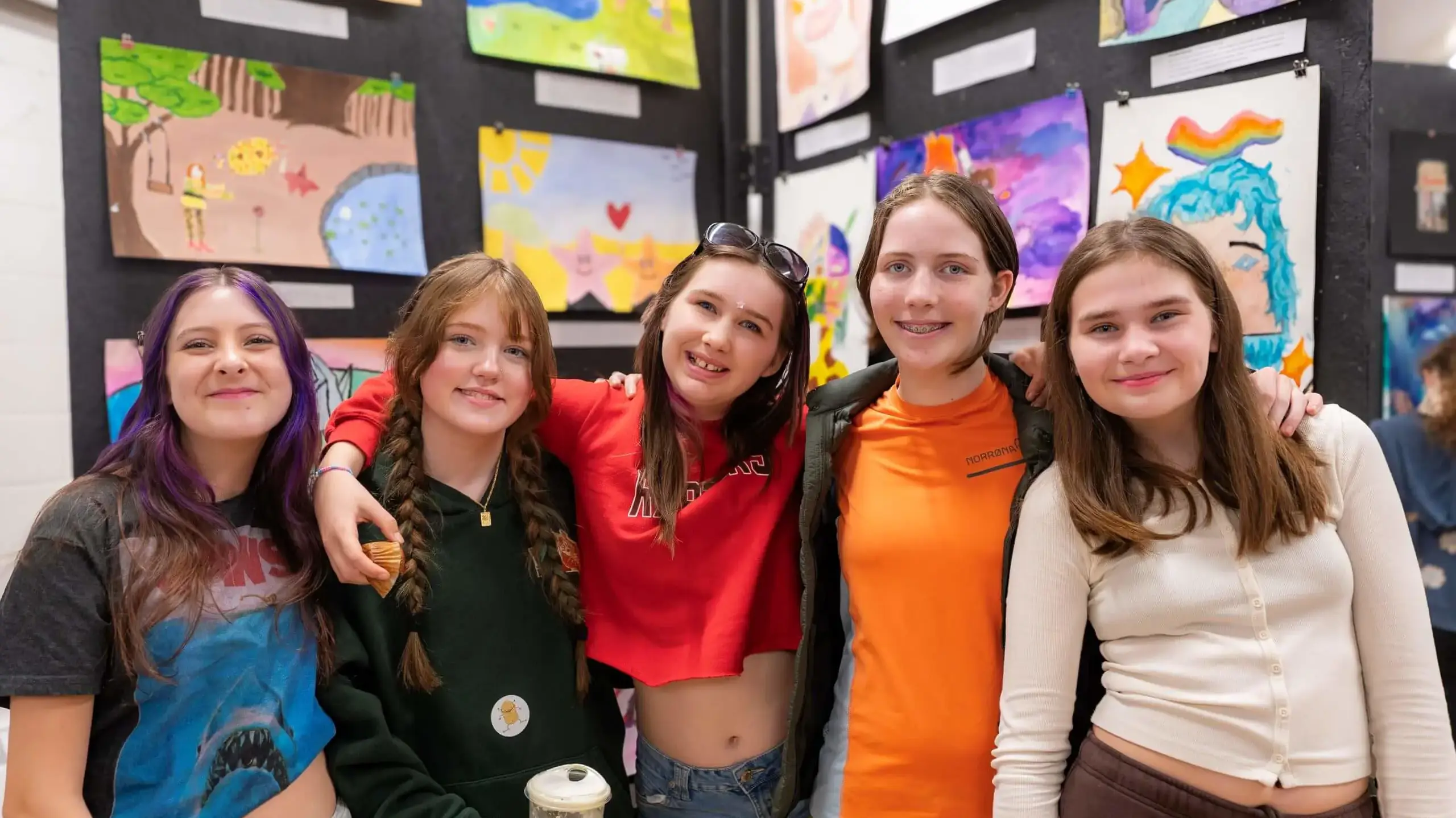 The Linden School students pose for a photograph together arm in arm.
